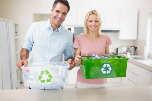 Professional waste removal workers handling office trash